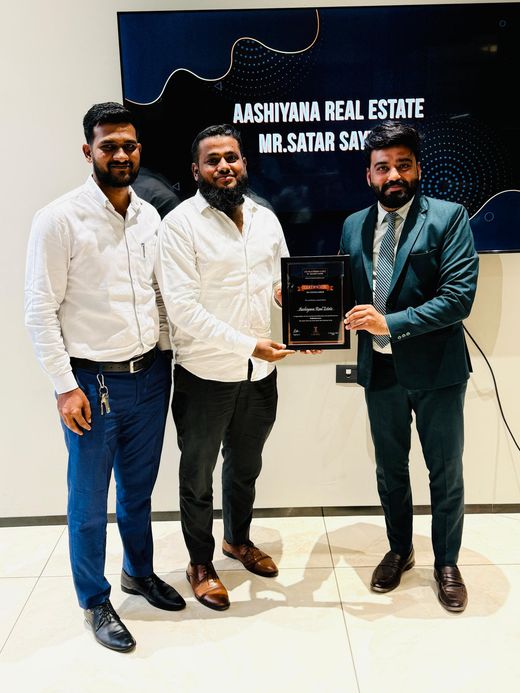 Ashiyana Real Estate clients and team at a property handover