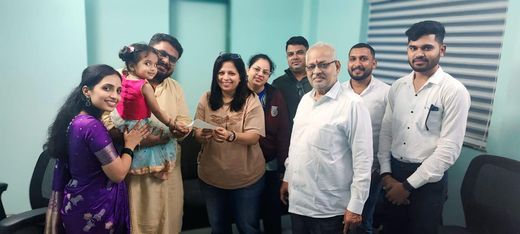 Ashiyana Real Estate clients and team at a property handover