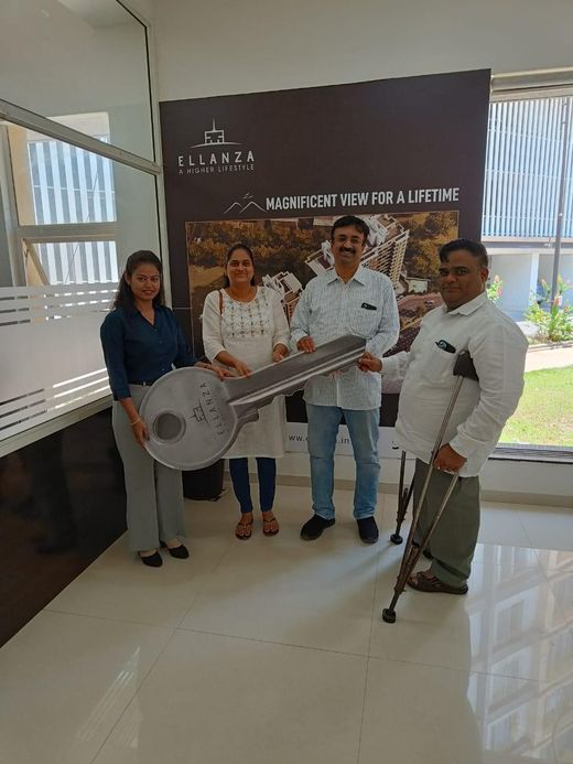 Ashiyana Real Estate clients and team at a property handover