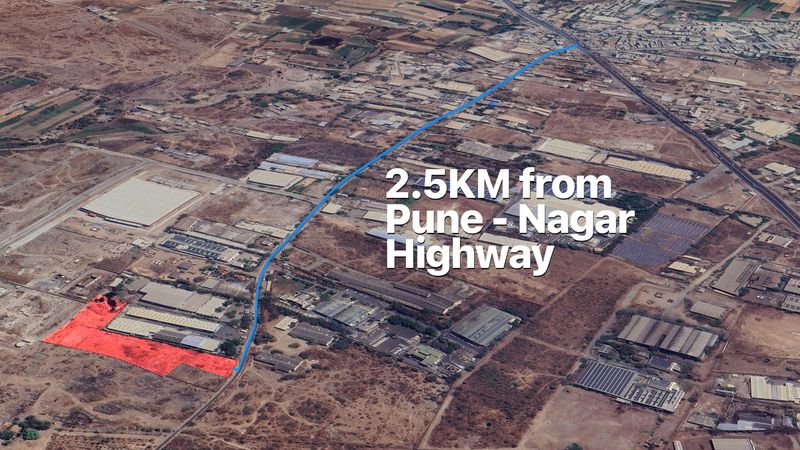 Aerial image showing the plot outlined in red and the 2.5 km road route to the Pune–Nagar highway